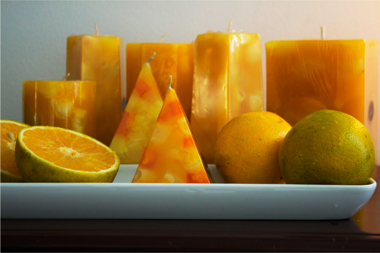 Velas con aroma a naranja, colores citricos